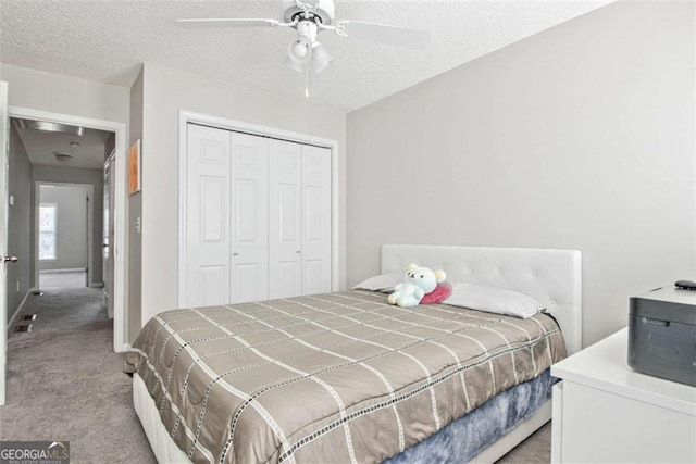 5 Corbel Way, Newnan, GA 30265 - carpeted bedroom with a closet, a textured ceiling, and ceiling fan