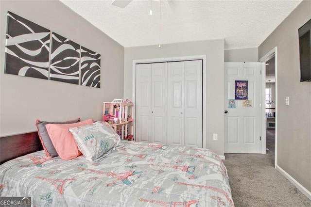 5 Corbel Way, Newnan, GA 30265 - bedroom with carpet flooring, a textured ceiling, a closet, ceiling fan, and baseboards
