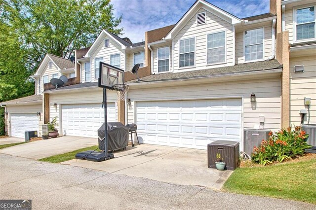 5 Corbel Way, Newnan, GA 30265 - multi unit property with driveway, central AC unit, and a garage