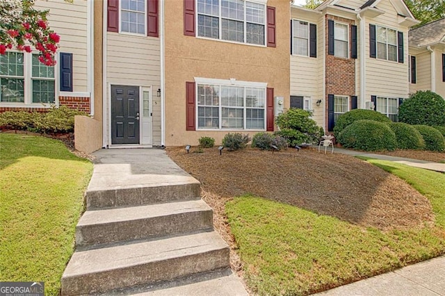 5 Corbel Way, Newnan, GA 30265 - doorway to property with a lawn