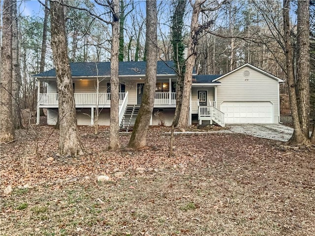 ranch-style home with a garage and a porch