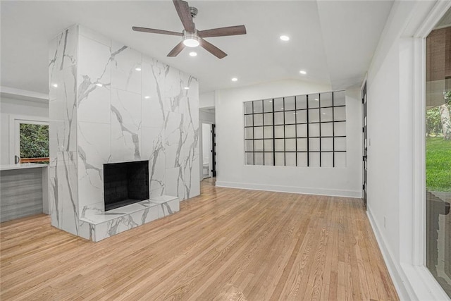 unfurnished living room with recessed lighting, wood finished floors, a fireplace, and ceiling fan