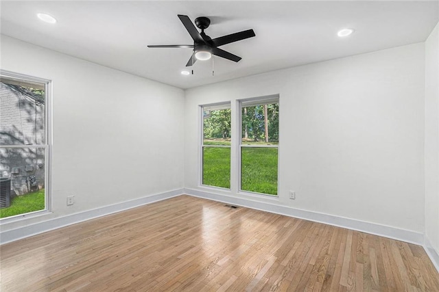 spare room with recessed lighting, baseboards, and light wood-style flooring