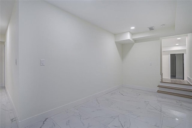 interior space featuring recessed lighting, visible vents, marble finish floor, and baseboards