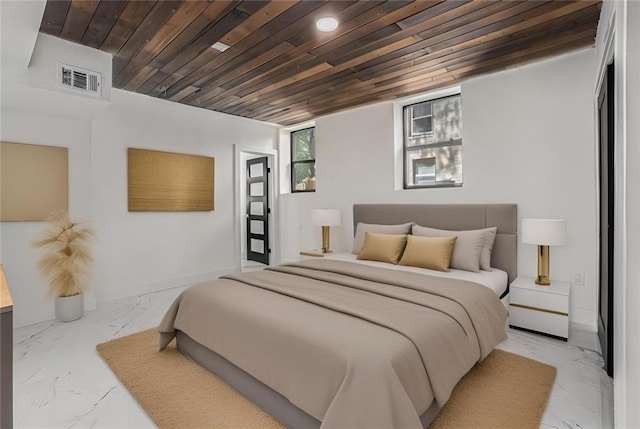 bedroom featuring visible vents, marble finish floor, wood ceiling, and baseboards