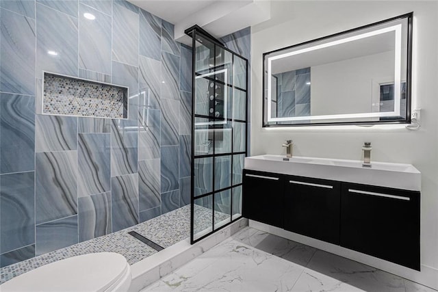 bathroom with double vanity, a sink, a walk in shower, toilet, and marble finish floor