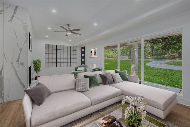 living room featuring a premium fireplace, recessed lighting, a ceiling fan, and wood finished floors