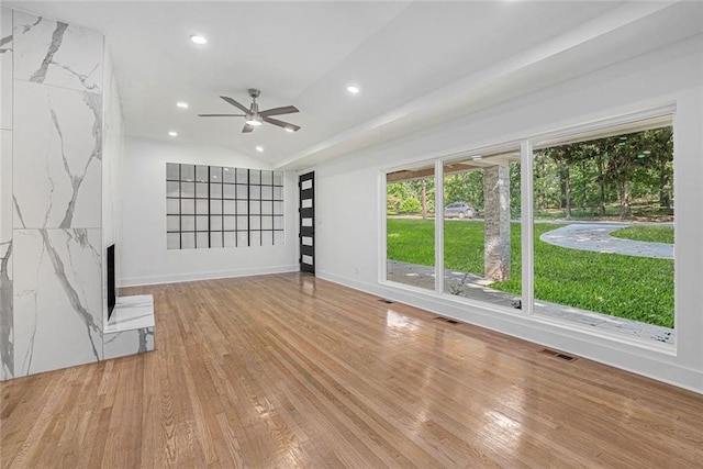 unfurnished living room featuring recessed lighting, visible vents, and hardwood / wood-style floors