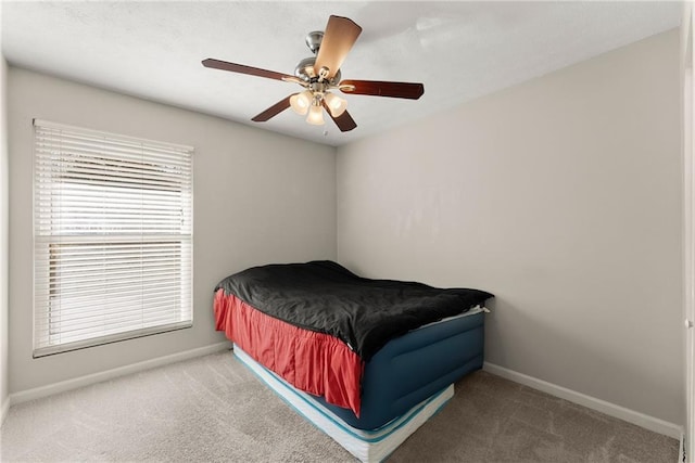 bedroom with ceiling fan and carpet