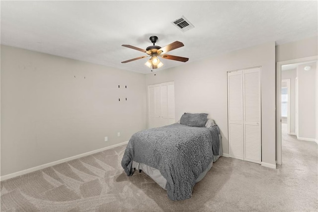 carpeted bedroom with ceiling fan