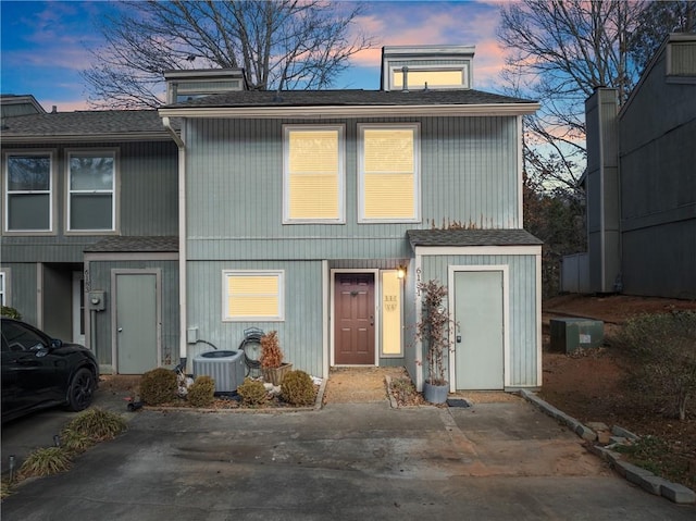 view of front of house featuring cooling unit