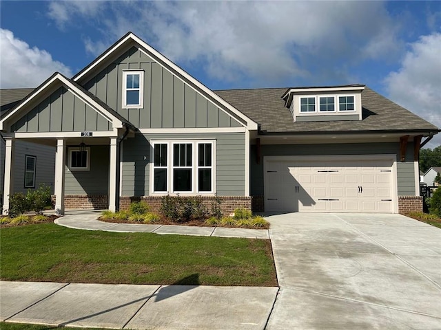 208 Saratoga Dr, Acworth, GA 30102 - craftsman-style house with brick siding, driveway, an attached garage, a front yard, and board and batten siding