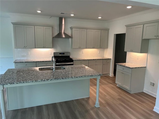 208 Saratoga Dr, Acworth, GA 30102 - kitchen with wall chimney exhaust hood, stainless steel gas range oven, a sink, gray cabinetry, and dark stone countertops