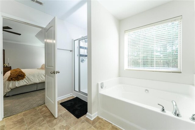 bathroom featuring shower with separate bathtub and ceiling fan