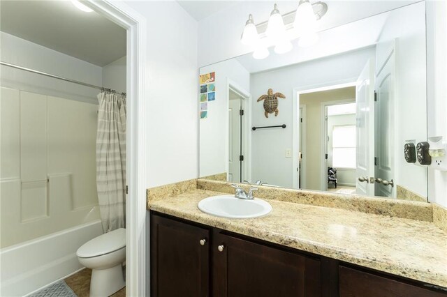 full bathroom featuring vanity, toilet, and shower / bathtub combination with curtain