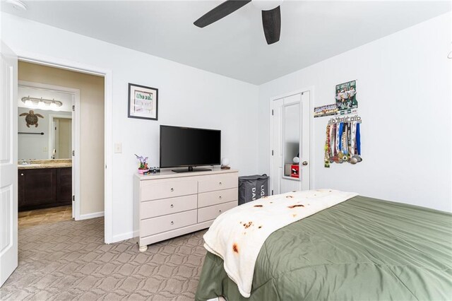 bedroom featuring connected bathroom and ceiling fan