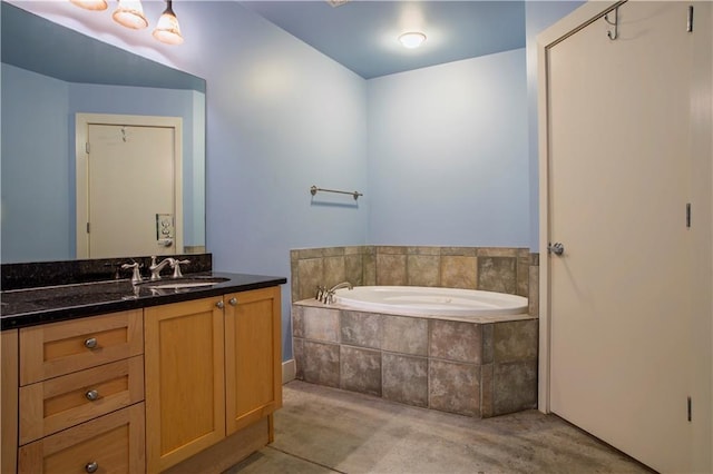 full bathroom with vanity and a bath