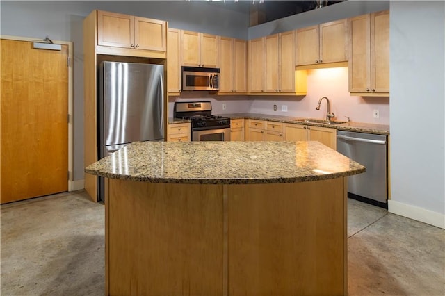 kitchen featuring a sink, light brown cabinets, stone countertops, and stainless steel appliances