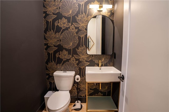 1122 Rice St NW, Atlanta, GA 30318 - bathroom featuring toilet, a sink, and wallpapered walls