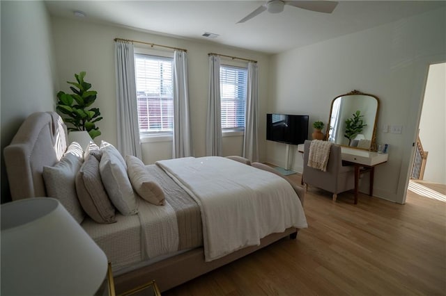 1122 Rice St NW, Atlanta, GA 30318 - bedroom with wood finished floors, a ceiling fan, and baseboards