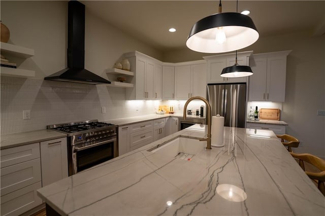1122 Rice St NW, Atlanta, GA 30318 - kitchen with appliances with stainless steel finishes, wall chimney range hood, open shelves, a sink, and backsplash