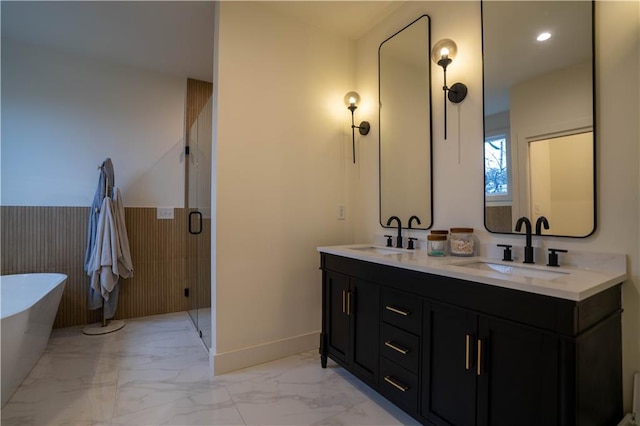 1122 Rice St NW, Atlanta, GA 30318 - bathroom featuring double vanity, a soaking tub, marble finish floors, baseboards, and a shower stall