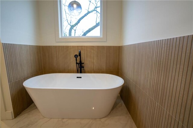 1122 Rice St NW, Atlanta, GA 30318 - bathroom with a freestanding bath, wainscoting, and marble finish flooring