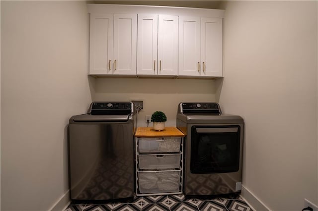 1122 Rice St NW, Atlanta, GA 30318 - laundry area featuring independent washer and dryer, baseboards, and cabinet space