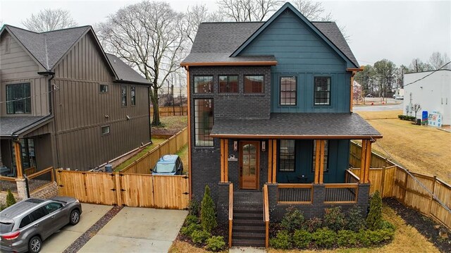 1122 Rice St NW, Atlanta, GA 30318 - view of front of property featuring a porch, a gate, a shingled roof, and brick siding