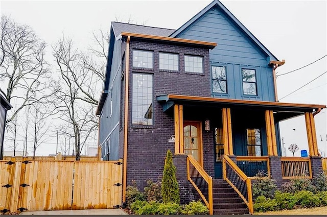 1122 Rice St NW, Atlanta, GA 30318 - view of front of home with brick siding, a porch, and a gate