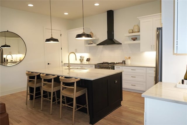 1122 Rice St NW, Atlanta, GA 30318 - kitchen with a sink, wall chimney exhaust hood, open shelves, decorative backsplash, and white cabinetry