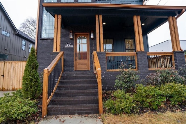 1122 Rice St NW, Atlanta, GA 30318 - view of exterior entry with a porch and brick siding