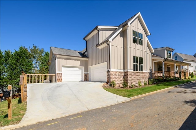 view of front of house featuring a porch and a garage