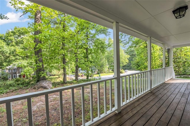 wooden terrace with a porch
