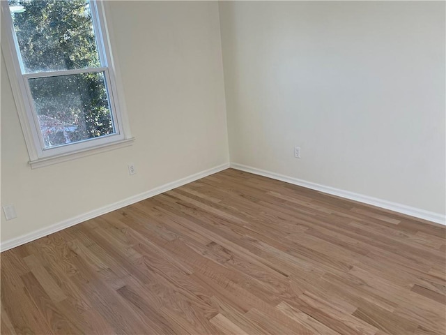 unfurnished room featuring light hardwood / wood-style flooring