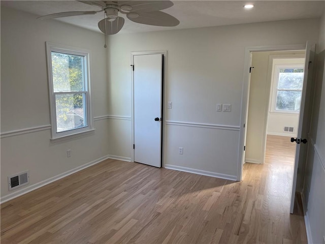 unfurnished bedroom with ceiling fan and light hardwood / wood-style flooring