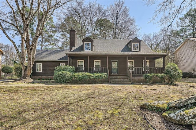 view of front of property featuring covered porch and a chimney