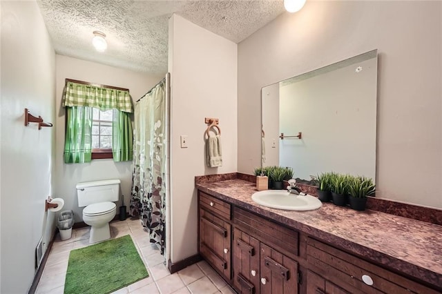 bathroom with tile patterned flooring, visible vents, toilet, vanity, and a textured ceiling