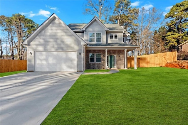 view of front facade with a front yard and a garage