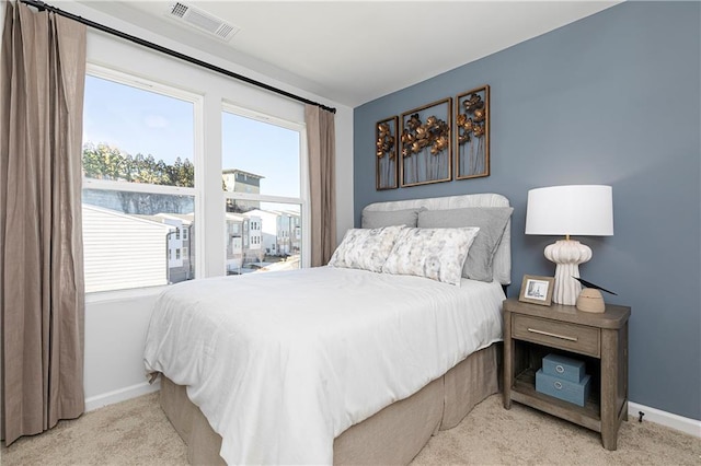 bedroom with carpet flooring and baseboards