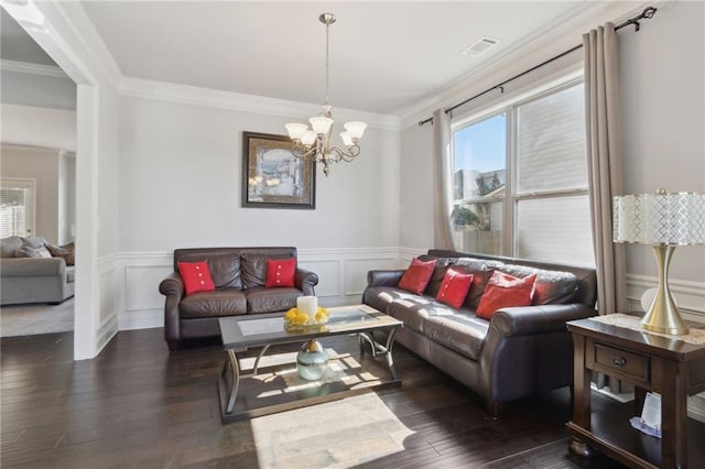 living room featuring dark wood-style floors, a wealth of natural light, visible vents, and crown molding