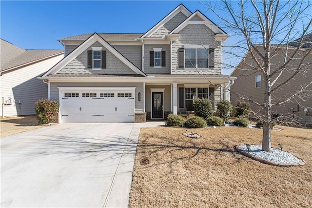 craftsman house featuring a garage and driveway