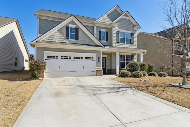 craftsman-style home featuring a garage and driveway