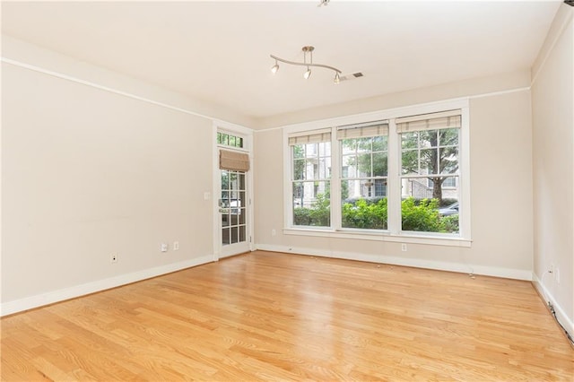 unfurnished room featuring light wood-type flooring