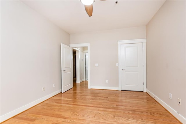 unfurnished bedroom with ceiling fan and light wood-type flooring