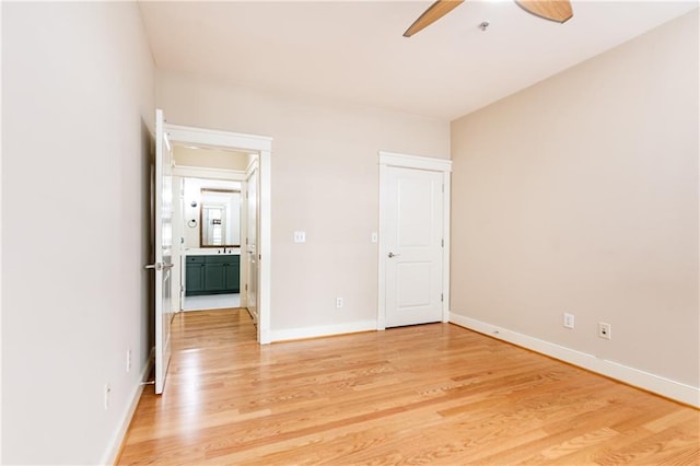 unfurnished bedroom featuring light wood-type flooring and ceiling fan