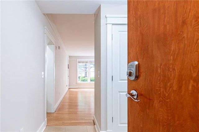 hallway with light tile patterned flooring