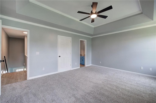128 Evergreen Trl Unit 4, Cartersville, GA 30121 - unfurnished bedroom featuring a tray ceiling, carpet floors, baseboards, connected bathroom, and crown molding