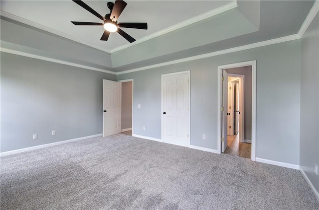 128 Evergreen Trl Unit 4, Cartersville, GA 30121 - unfurnished bedroom featuring carpet flooring, baseboards, ornamental molding, a raised ceiling, and a ceiling fan