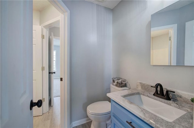 128 Evergreen Trl Unit 4, Cartersville, GA 30121 - bathroom with vanity, toilet, and baseboards